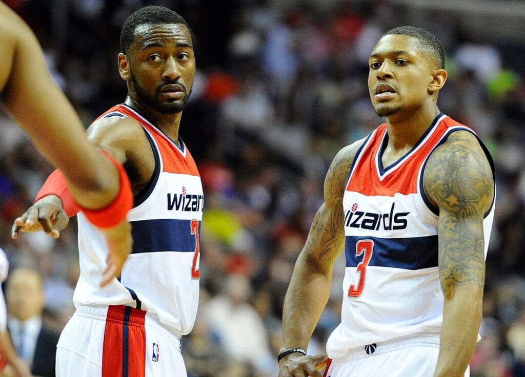 May 15, 2015; Washington, DC, USA; Washington Wizards guard John Wall (2) and guard Bradley Beal (3) react against the Atlanta Hawks during the second half in game six of the second round of the NBA Playoffs at Verizon Center.
