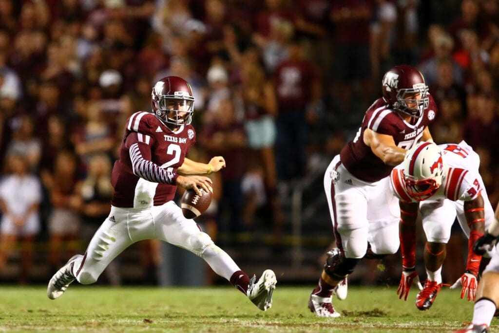 Sep 21, 2013; College Station, TX, USA; Texas A&M Aggies quarterback Johnny Manziel (2) runs the ball against the SMU Mustangs in the second half at Kyle Field.