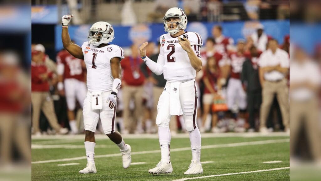 Jan 04, 2013; Arlington, TX, USA; Texas A&M Aggies quarterback Johnny Manziel (2) celebrates a first down with running back Ben Malena (1) during the game against the Oklahoma Sooners in the 2013 Cotton Bowl at Cowboys Stadium. Texas A&M won 41-13.