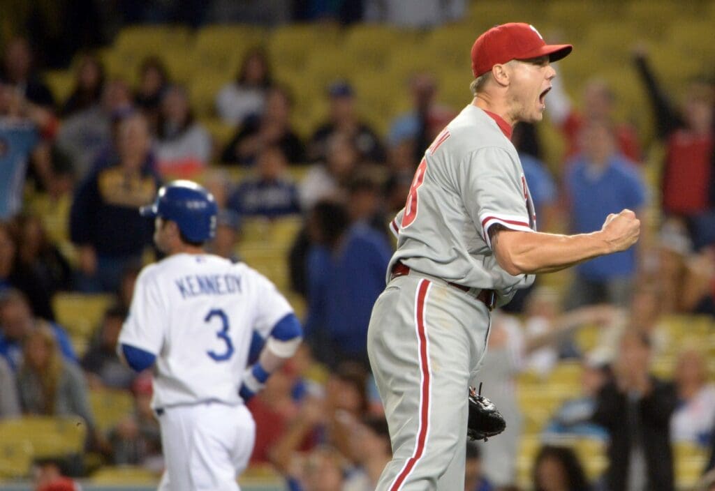 Jul 16, 2012; Los Angeles, CA, USA; Philadelphia Phillies reliever Jonathan Papelbon (58) reacts after retiring Los Angeles Dodgers pinch hitter Adam Kennedy (3) on a fly ball at the end of the game at Dodger Stadium. The Phillies defeated the Dodgers 3-2.