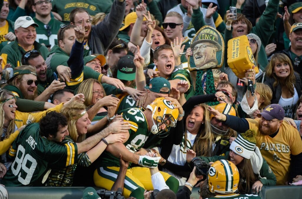 Sep 14, 2014; Green Bay, WI, USA; Green Bay Packers wide receiver Jordy Nelson (87) celebrates with fans after catching an 80-yard touchdown pass in the third quarter against the New York Jets at Lambeau Field.