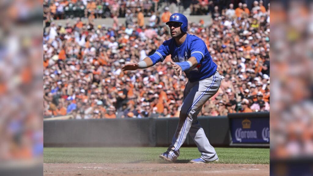 Jun 15, 2014; Baltimore, MD, USA; Toronto Blue Jays right fielder Jose Bautista (19) pleads his case with umpire Hunter Wendelstedt (not pictured) after being getting called out during the eighth inning against the Baltimore Orioles at Oriole Park at Camden Yards. Toronto Blue Jays defeat the Baltimore Orioles 5-2.