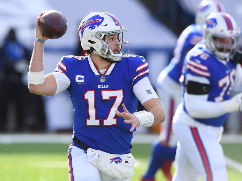 Jan 9, 2021; Orchard Park, New York, USA; Buffalo Bills quarterback Josh Allen (17) throws against the Indianapolis Colts during the first half in the AFC Wild Card game at Bills Stadium.