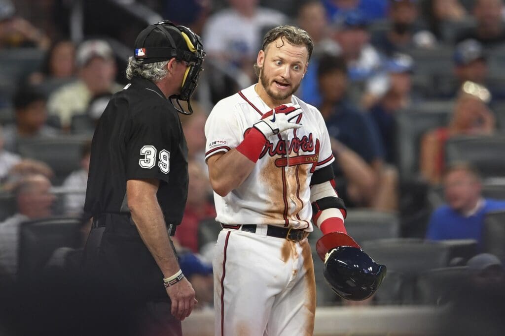 Aug 17, 2019; Atlanta, GA, USA; Atlanta Braves third baseman Josh Donaldson (20) talks with umpire Paul Nauert (39) after being called out on strikes against the Los Angeles Dodgers during the third inning at SunTrust Park.