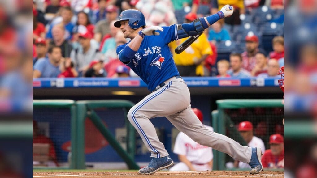 Jun 16, 2016; Philadelphia, PA, USA; Toronto Blue Jays third baseman Josh Donaldson (20) hits a single during the first inning against the Philadelphia Phillies at Citizens Bank Park.