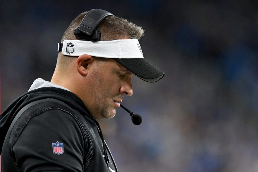 Oct 30, 2023; Detroit, Michigan, USA; Las Vegas Raiders head coach Josh McDaniels checks his play sheet on the sidelines during the fourth quarter of their game against the Detroit Lions at Ford Field.