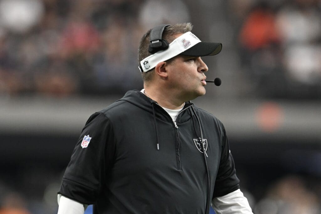 Oct 15, 2023; Paradise, Nevada, USA; Las Vegas Raiders head coach Josh McDaniels looks down field against the New England Patriots in the fourth quarter at Allegiant Stadium.