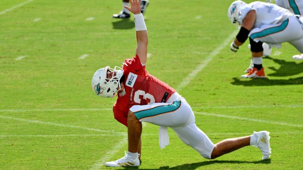 Aug 22, 2020; Miami Gardens, Florida, USA; Miami Dolphins quarterback Josh Rosen (3) stretches during training camp at Baptist Health Training Facility.