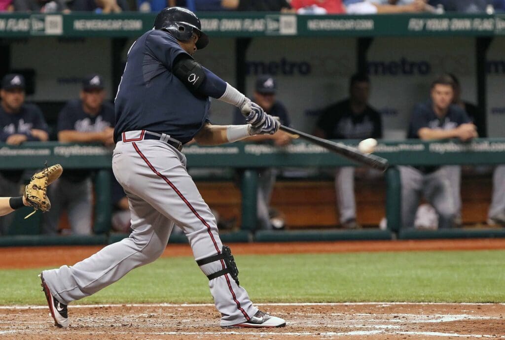 May 18, 2012; St. Petersburg, FL, USA; Atlanta Braves third baseman Juan Francisco (25) hits a single in the eighth inning against the Tampa Bay Rays at Tropicana Field. Atlanta Braves defeated the Tampa Bay Rays 5-3.