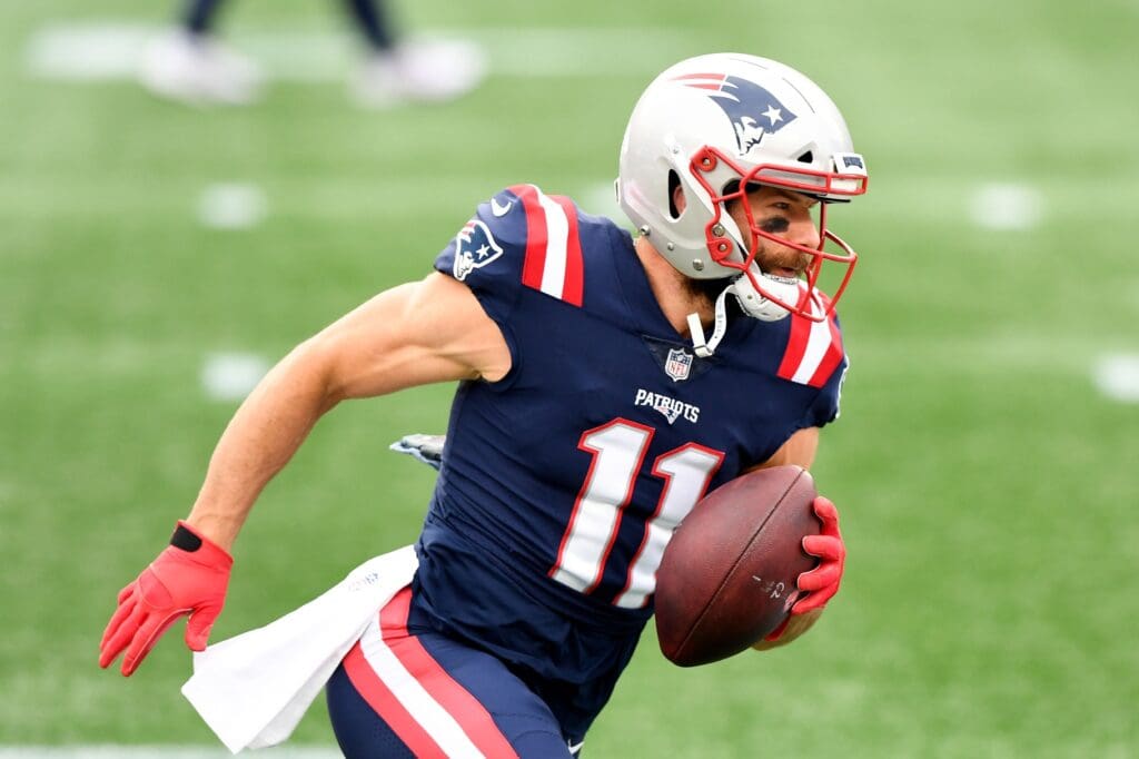 Oct 25, 2020; Foxborough, Massachusetts, USA; New England Patriots wide receiver Julian Edelman (11) runs with the ball during warmups before a game against the San Francisco 49ers at Gillette Stadium.