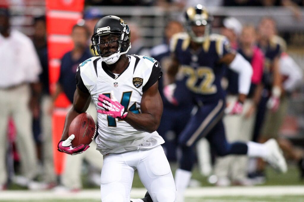 Oct 6, 2013; St. Louis, MO, USA; Jacksonville Jaguars wide receiver Justin Blackmon (14) carries the ball for a touchdown during the first quarter against the St. Louis Rams at The Edward Jones Dome.