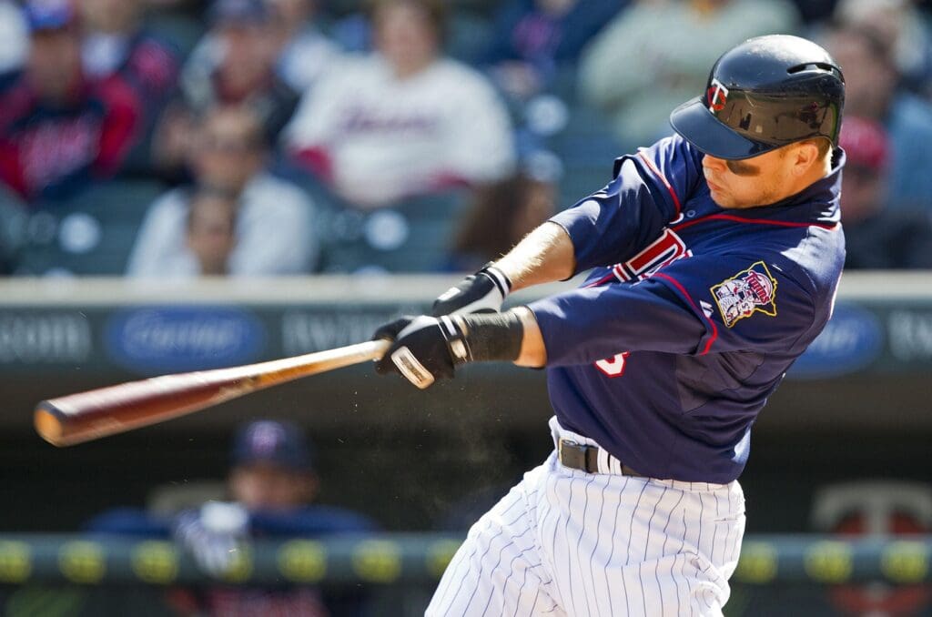 Apr 12, 2012; Minneapolis, MN, USA: Minnesota Twins designated hitter Justin Morneau (33) hits a two run home run in the eighth inning against the Los Angeles Angels at Target Field. The Twins won 10-9.