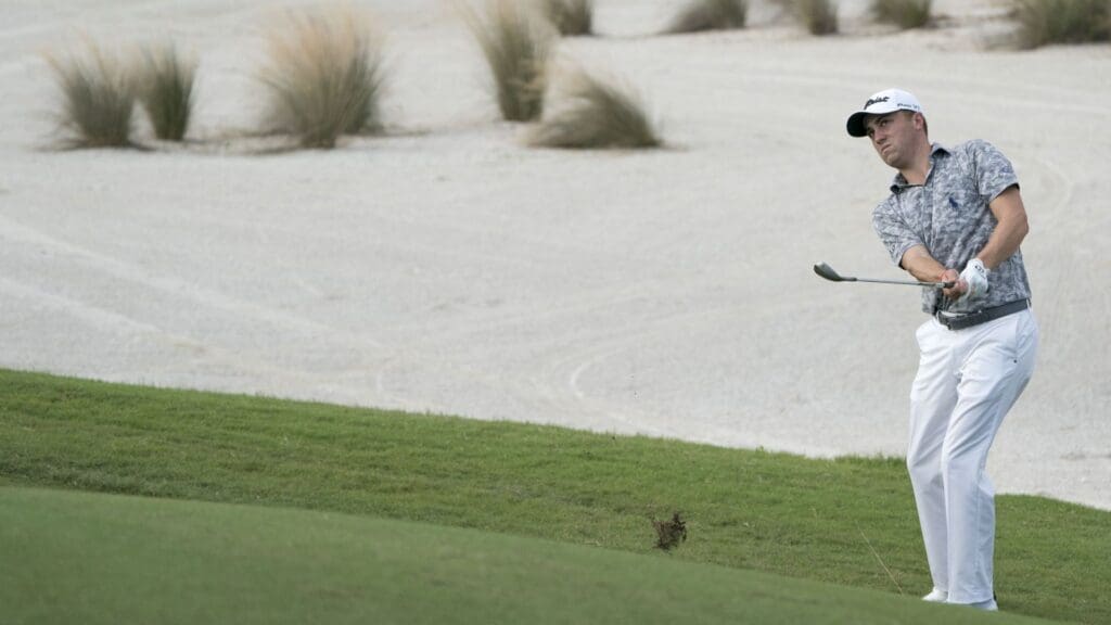 November 28, 2017; New Providence, The Bahamas; Justin Thomas hits his chip shot on the 11th hole during Tuesday's practice round of the Hero World Challenge golf tournament at Albany.