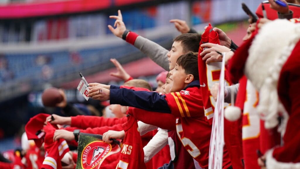 Dec 17, 2023; Foxborough, Massachusetts, USA; Kansas City Chiefs fans look for autographs as the team warms up before the game against the New England Patriots at Gillette Stadium.