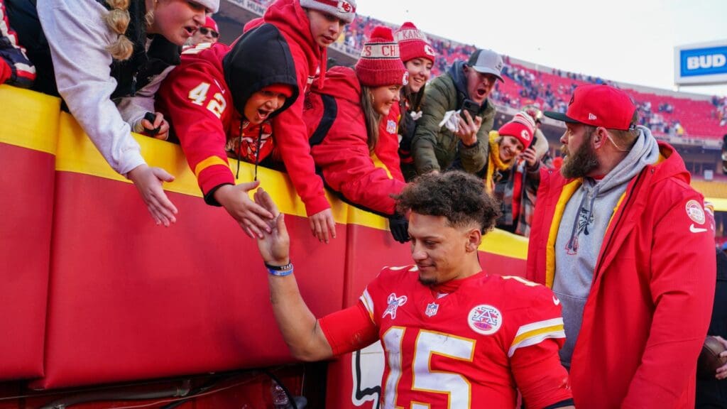 Dec 21, 2024; Kansas City, Missouri, USA; Kansas City Chiefs quarterback Patrick Mahomes (15) greets fans while leaving the stadium after the win over the Houston Texans at GEHA Field at Arrowhead Stadium