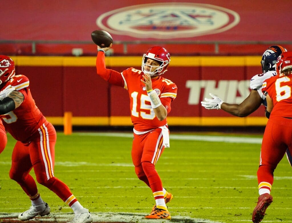 Dec 6, 2020; Kansas City, Missouri, USA; Kansas City Chiefs quarterback Patrick Mahomes (15) throws a pass against the Denver Broncos during the first half at Arrowhead Stadium.