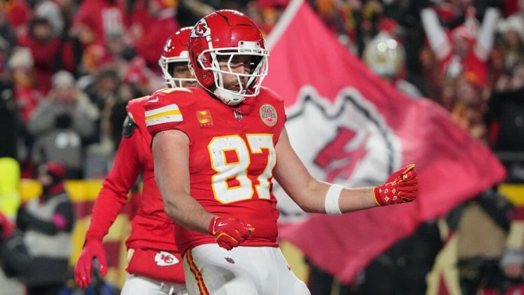 Jan 18, 2025; Kansas City, Missouri, USA; Kansas City Chiefs tight end Travis Kelce (87) reacts after catching a pass for a touchdown against the Houston Texans during the fourth quarter of a 2025 AFC divisional round game at GEHA Field at Arrowhead Stadium.