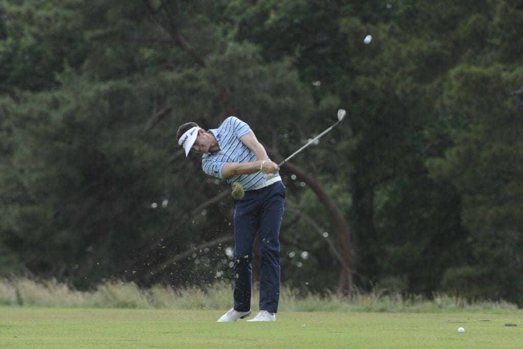 Jun 14, 2013; Ardmore, PA, USA; Keegan Bradley hits a fairway shot on the fourth hole during the second round of the 113th U.S. Open golf tournament at Merion Golf Club.