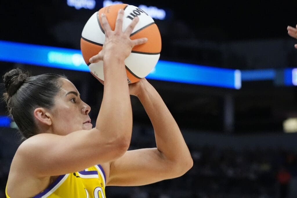 Jun 21, 2025; Minneapolis, Minnesota, USA; Los Angeles Sparks guard Kelsey Plum (10) shoots against the Minnesota Lynx in the first quarter at Target Center.