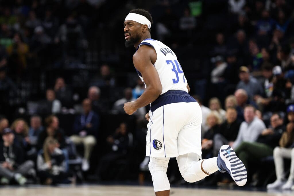 Dec 21, 2022; Minneapolis, Minnesota, USA; Dallas Mavericks guard Kemba Walker (34) reacts to his shot against the Minnesota Timberwolves during the second period at Target Center.