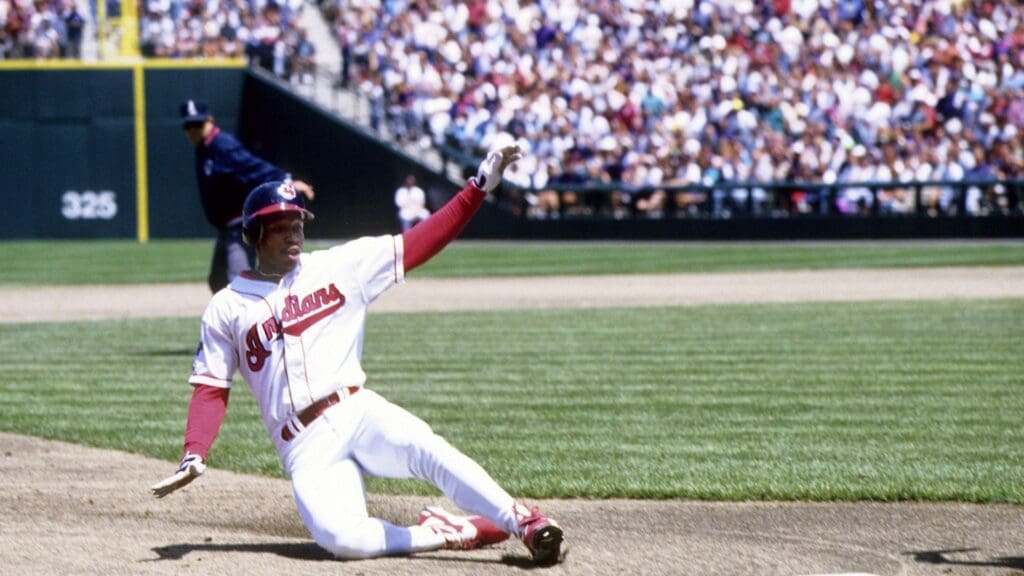 1995, Cleveland, OH, USA; FILE PHOTO; Cleveland Indians center fielder Kenny Lofton slides into third base at Jacobs Field during the 1995 season