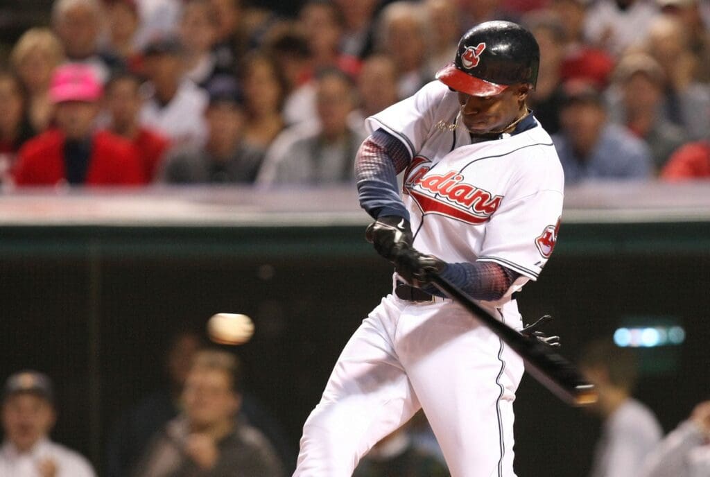 Oct 15, 2007; Cleveland, OH, USA; Cleveland Indians left fielder (7) Kenny Lofton hits a 2-run home run in the 2nd inning against the Boston Red Sox during game 3 of the 2007 American League Championship Series at Jacobs Field.