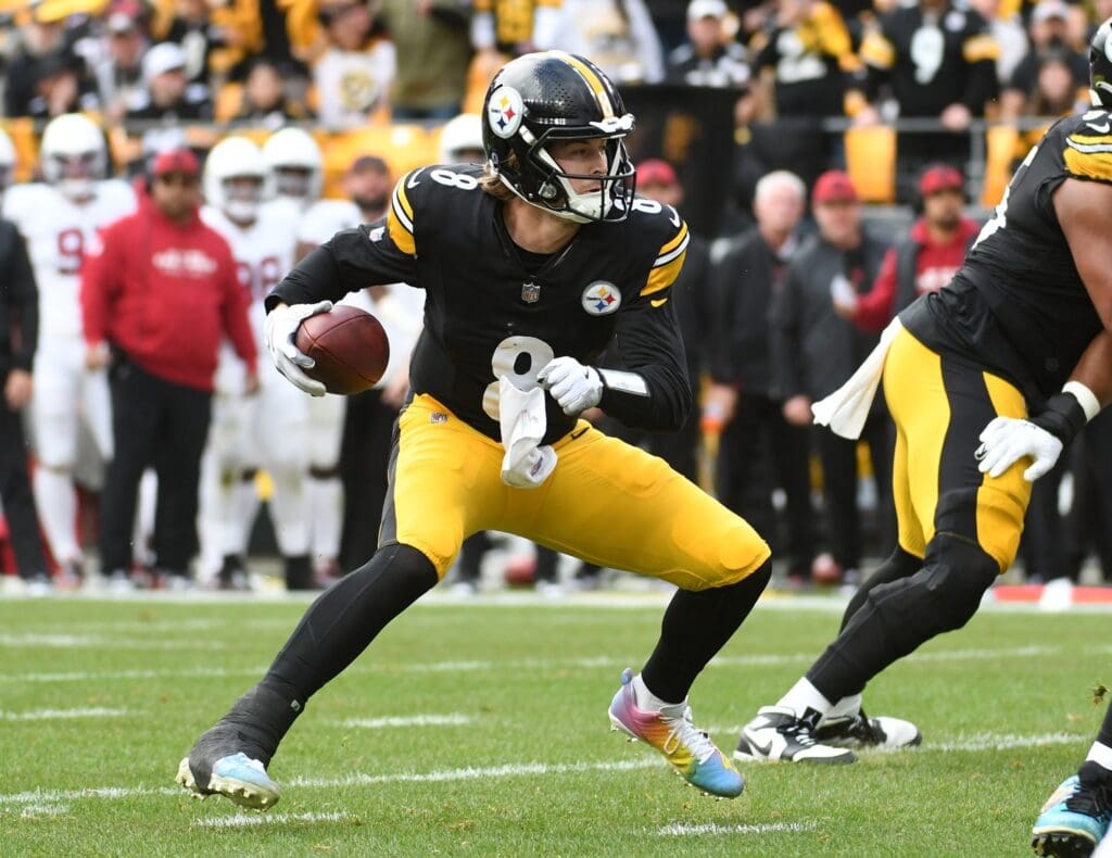 Dec 3, 2023; Pittsburgh, Pennsylvania, USA; Pittsburgh Steelers quarterback Kenny Pickett (8) plays the ball against the Arizona Cardinals during the second quarter at Acrisure Stadium.