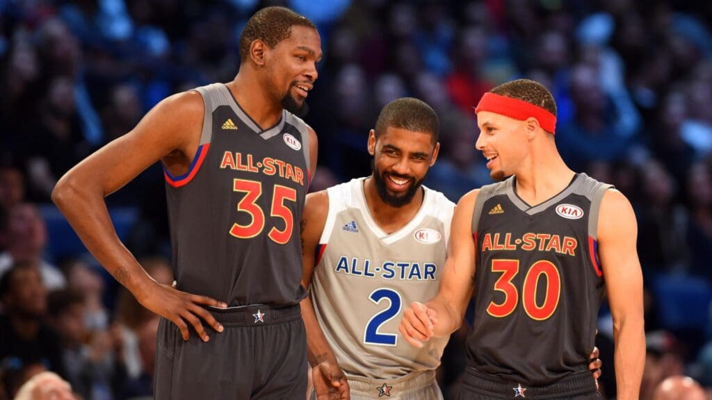 Feb 19, 2017; New Orleans, LA, USA; Western Conference forward Kevin Durant of the Golden State Warriors (35), Eastern Conference forward Kyrie Irving of the Cleveland Cavaliers (2) and Western Conference guard Stephen Curry of the Golden State Warriors (30) talk in the 2017 NBA All-Star Game at Smoothie King Center.