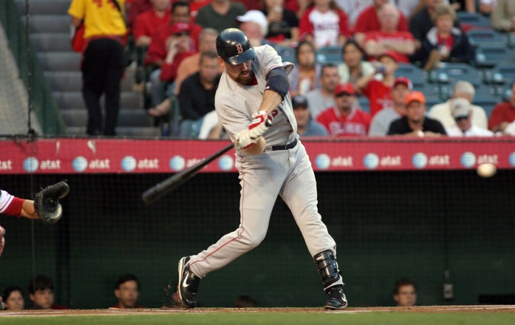 August 7, 2007; Anaheim CA, USA; Boston Red Sox first baseman Kevin Youkilis (20) hits a single in the first inning against the Los Angeles Angels at Angel Stadium in Anaheim.