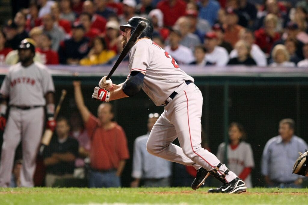 Oct 18, 2007; Cleveland, OH, USA; Boston Red Sox first baseman (20) Kevin Youkilis hits an RBI triple in the 7th inning against the Cleveland Indians during game 5 of the 2007 American League Championship Series at Jacobs Field.