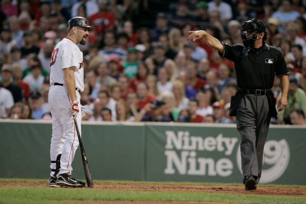 July 30, 2008; Boston, MA, USA; Boston Red Sox first baseman Kevin Youkilis (20) has a word with the umpire after striking out in the third inning against the Los Angeles Angels at Fenway Park.