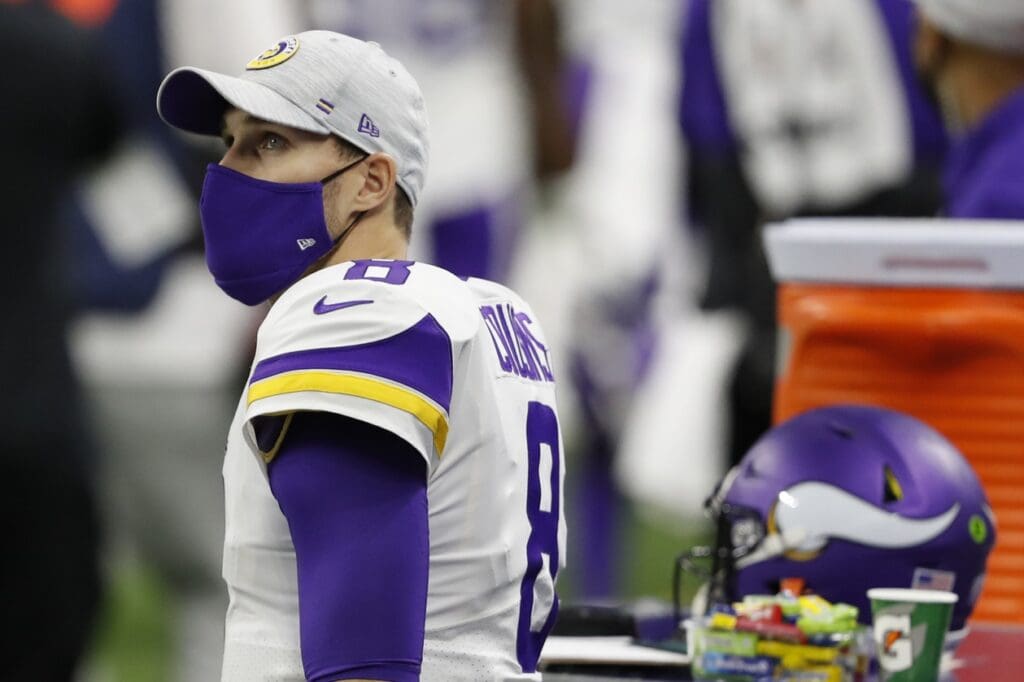 Jan 3, 2021; Detroit, Michigan, USA; Minnesota Vikings quarterback Kirk Cousins (8) looks up at the big screen display during the first quarter against the Detroit Lions at Ford Field.