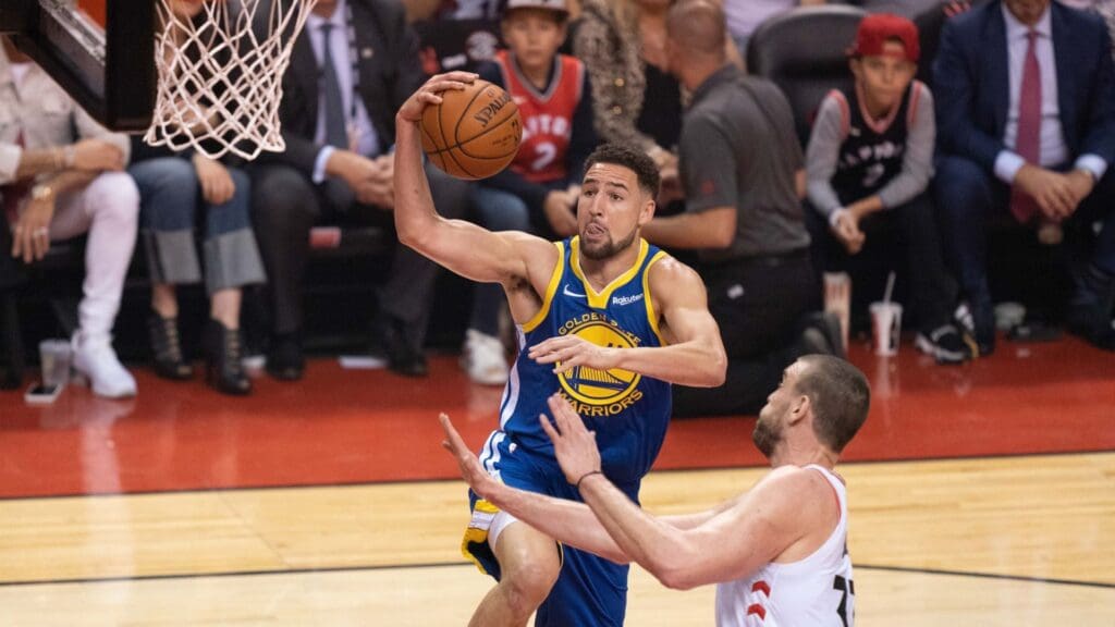 May 30, 2019; Toronto, Ontario, CAN; Golden State Warriors guard Klay Thompson (11) shoots against Toronto Raptors center Marc Gasol (33) during the first quarter in game one of the 2019 NBA Finals at Scotiabank Arena.