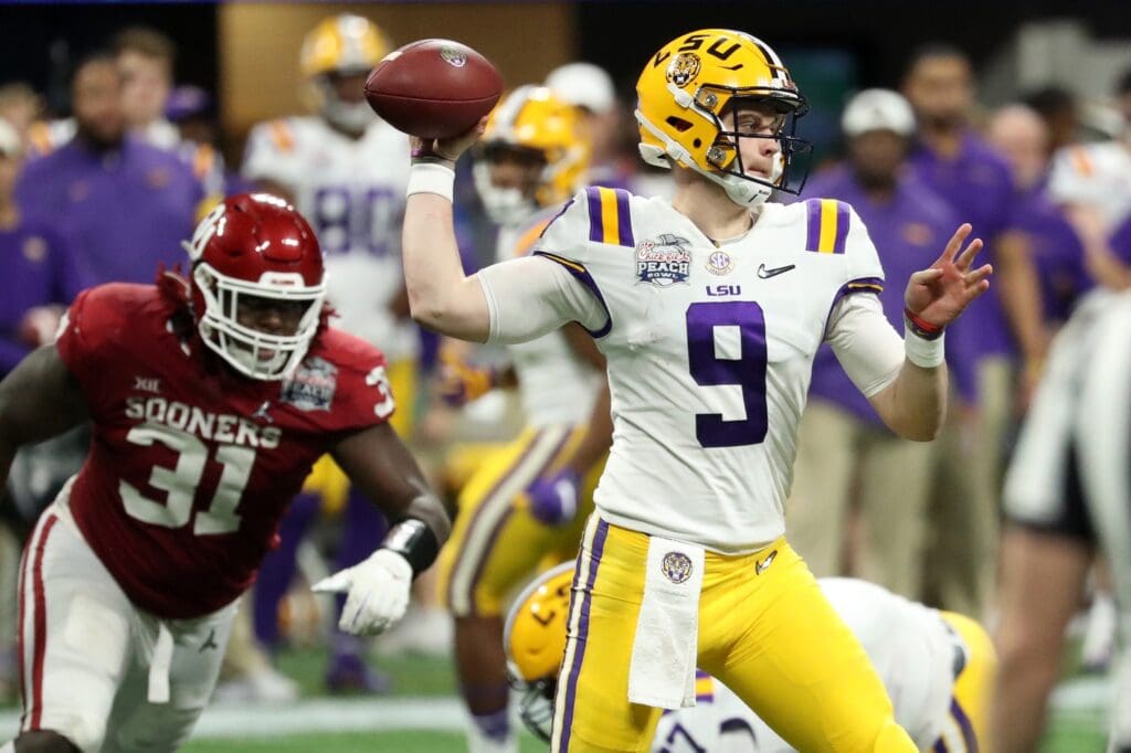 LSU Tigers quarterback Joe Burrow (9) attempts a pass during the second half of the 2019 Peach Bowl college football playoff semifinal game against the Oklahoma Sooners at Mercedes-Benz Stadium.