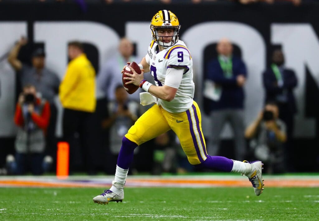 Jan 13, 2020; New Orleans, Louisiana, USA; LSU Tigers quarterback Joe Burrow (9) runs with the ball against the Clemson Tigers in the College Football Playoff national championship game at Mercedes-Benz Superdome