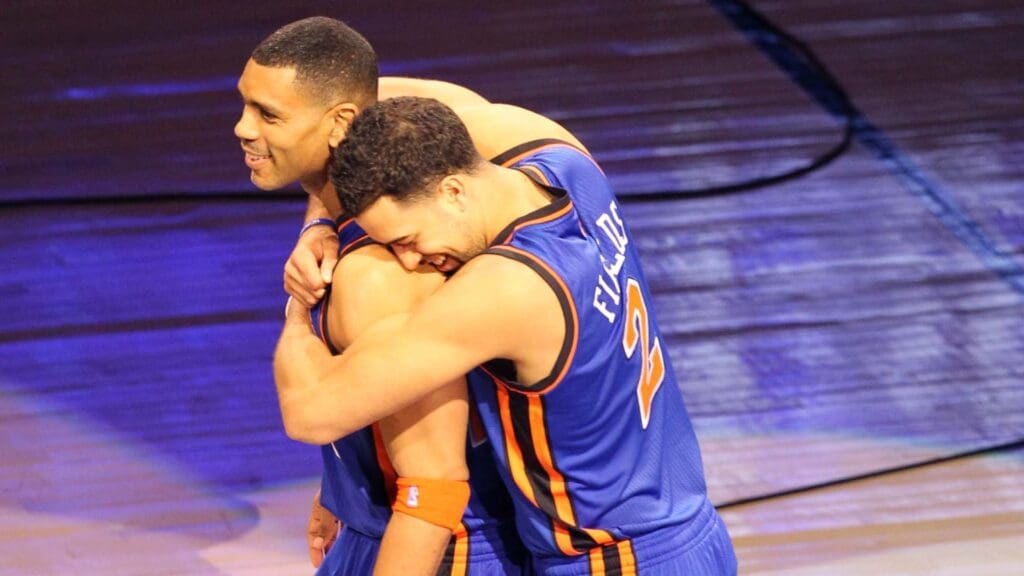 February 25, 2012; Orlando FL, USA; Landry Fields (right) of team New York hugs Allan Houston after winning the 2012 NBA All-Star Shooting Stars competition at the Amway Center.
