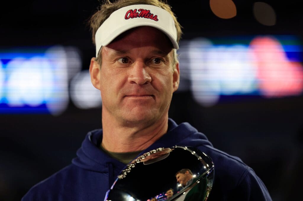 Mississippi Rebels head coach Lane Kiffin is interviewed after the game while holding the Ash Verlander Champions Trophy of the TaxSlayer Gator Bowl Thursday, Jan. 2, 2025 at EverBank Stadium in Jacksonville, Fla. Ole Miss defeated Duke 52-20.