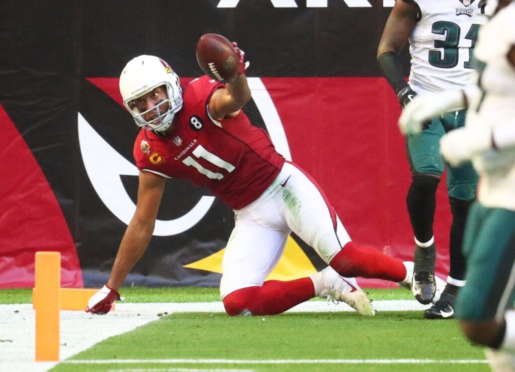 Dec 20, 2020; Glendale, Arizona, USA; Arizona Cardinals wide receiver Larry Fitzgerald (11) scores a touchdown against the Philadelphia Eagles in the first half at State Farm Stadium.