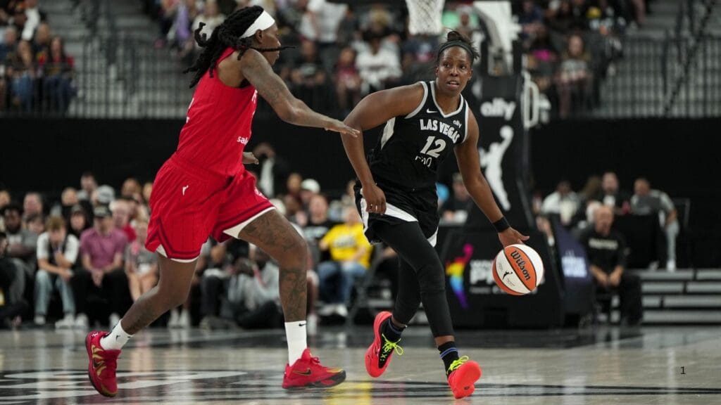 Jun 22, 2025; Las Vegas, Nevada, USA; Las Vegas Aces guard Chelsea Gray (12) dribbles the ball against Indiana Fever center Aliyah Boston (7) during the first half of a WNBA basketball game at T-Mobile Arena.
