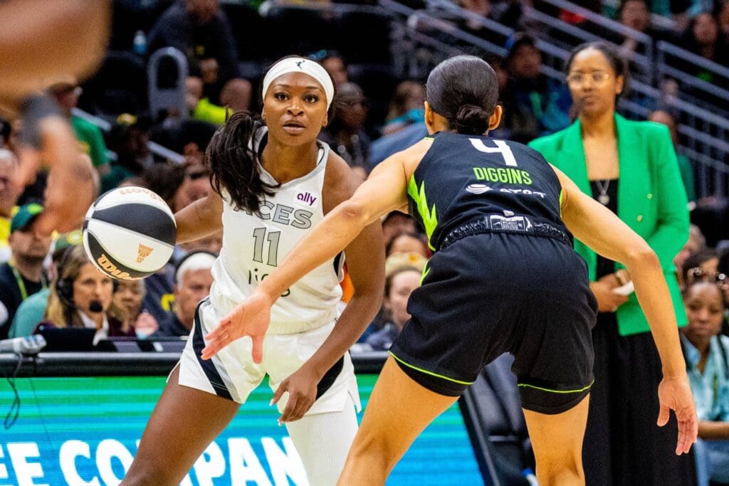 Jun 1, 2025; Seattle, Washington, USA; Las Vegas Aces guard Dana Evans (11) tries to take the ball to net with Seattle Storm guard Skylar Diggins (4) on defense in the fourth period at Climate Pledge Arena.