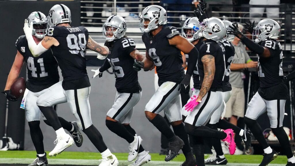 Oct 9, 2023; Paradise, Nevada, USA; Las Vegas Raiders linebacker Robert Spillane (41) celebrates with team mates after making an interception against the Green Bay Packers during the second quarter at Allegiant Stadium