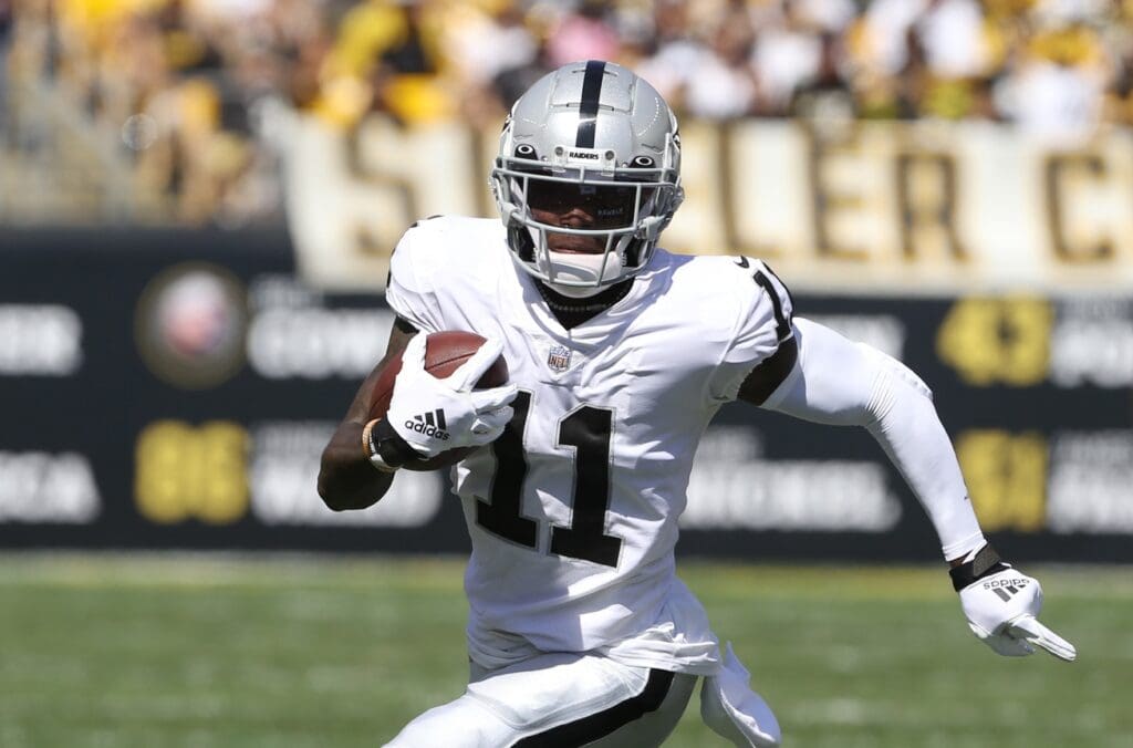 Sep 19, 2021; Pittsburgh, Pennsylvania, USA; Las Vegas Raiders wide receiver Henry Ruggs III (11) runs after a catch against the Pittsburgh Steelers during the second quarter at Heinz Field.