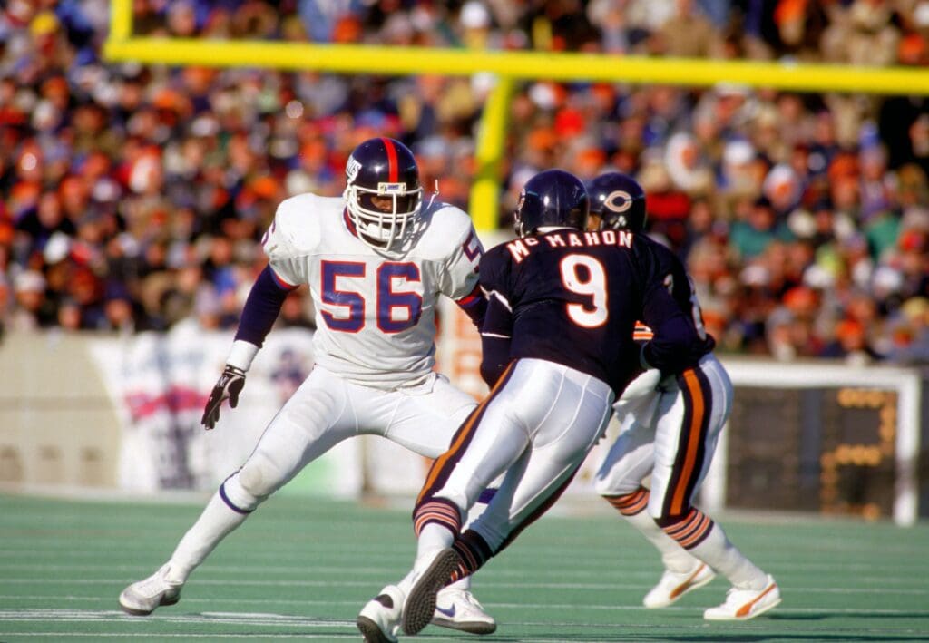 Jan 5, 1986; Chicago, IL, USA; FILE PHOTO; New York Giants linebacker (56) LAWRENCE TAYLOR pursues Chicago Bears quarterback (9) JIM MC MAHON at Soldier Field during the 1985 NFC Divisional Playoff Game. The Bears defeated the Giants 21-0.