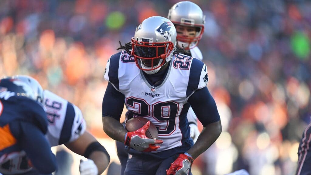 Dec 18, 2016; Denver, CO, USA; New England Patriots running back LeGarrette Blount (29) carries the ball for a touchdown in the second quarter against the Denver Broncos at Sports Authority Field