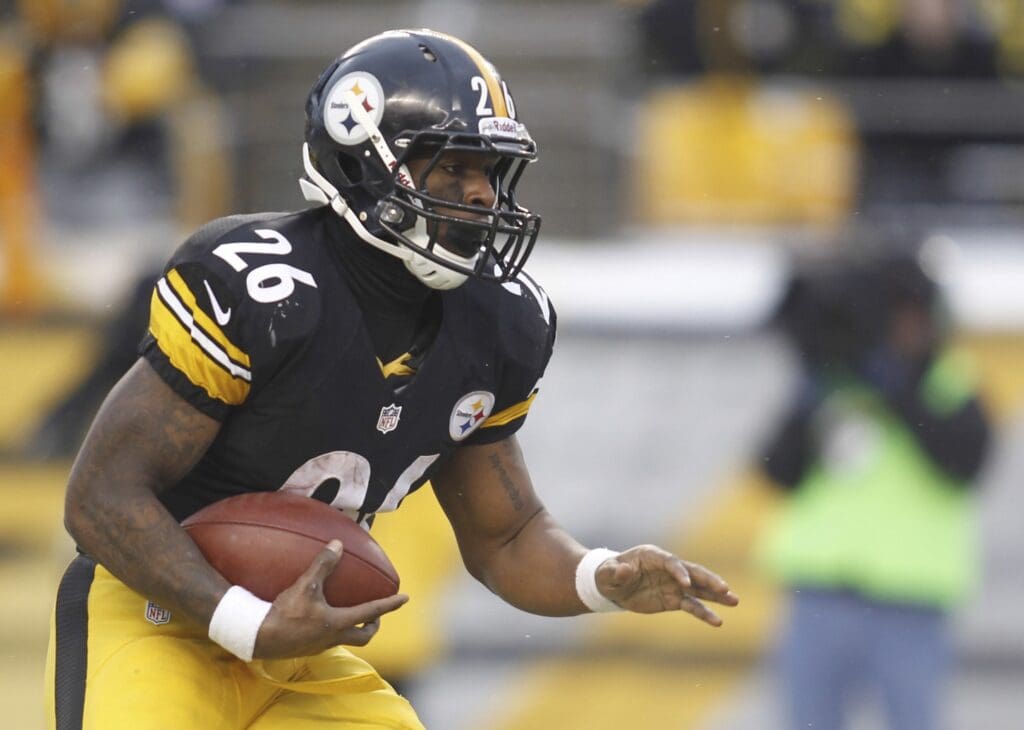 Dec 8, 2013; Pittsburgh, PA, USA; Pittsburgh Steelers running back Le'Veon Bell (26) carries the ball against the Miami Dolphins during the third quarter at Heinz Field. The Miami Dolphins won 34-28