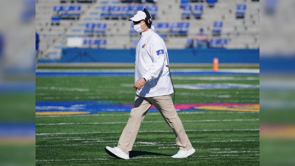 Oct 31, 2020; Lawrence, Kansas, USA; Kansas Jayhawks head coach Les Miles leaves the field after checking on an injury during the game against the Iowa State Cyclones at David Booth Kansas Memorial Stadium.