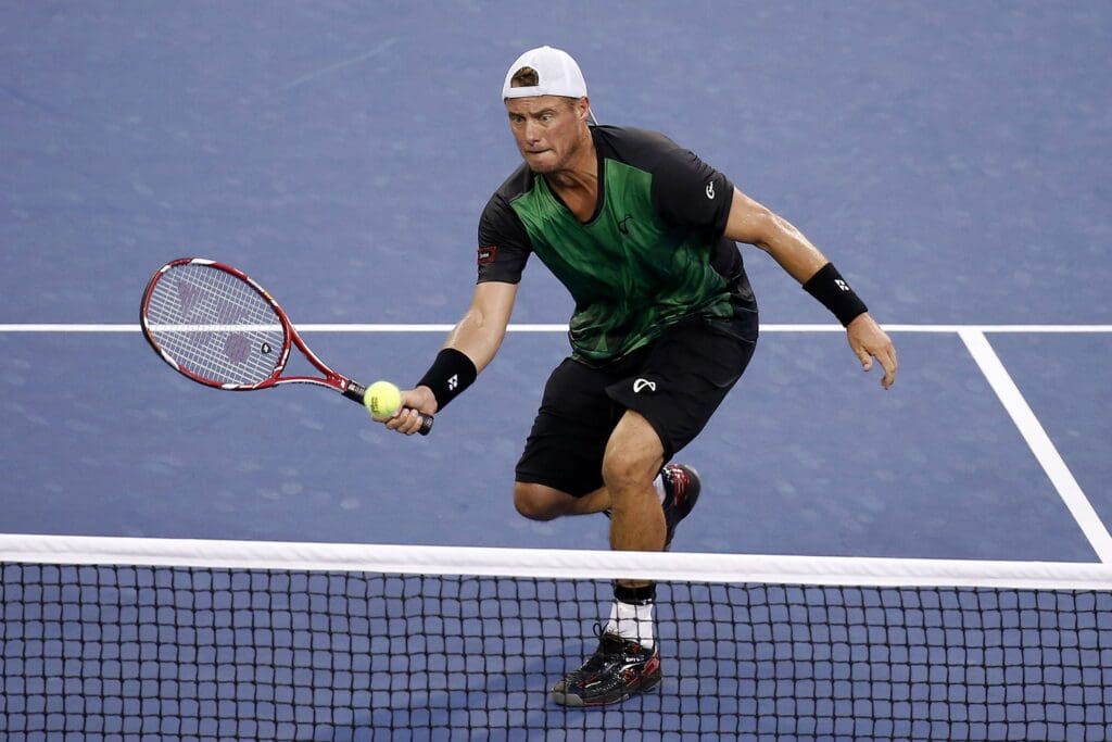 Sep 3, 2015; New York, NY, USA; Lleyton Hewitt of Australia his a volley against Bernard Tomic of Australia (not pictured) on day four of the 2015 U.S. Open tennis tournament at USTA Billie Jean King National Tennis Center. Tomic won 6-3, 6-2, 3-6, 5-7, 7-5.