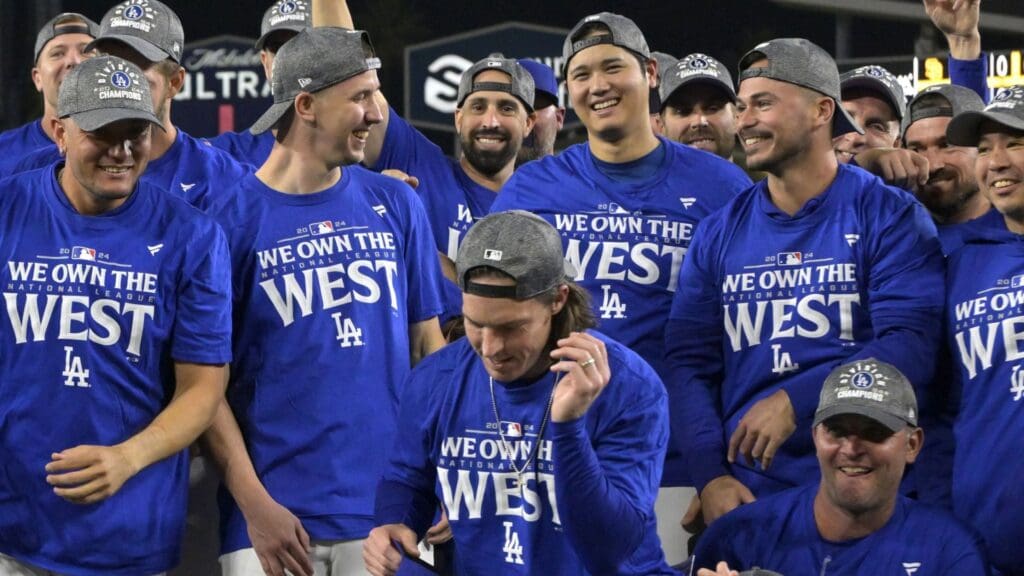 Sep 26, 2024; Los Angeles, California, USA; Los Angeles Dodgers designated hitter Shohei Ohtani (17) along with the team celebrate after clinching the National League West by defeating the San Diego Padres 7-2 at Dodger Stadium.