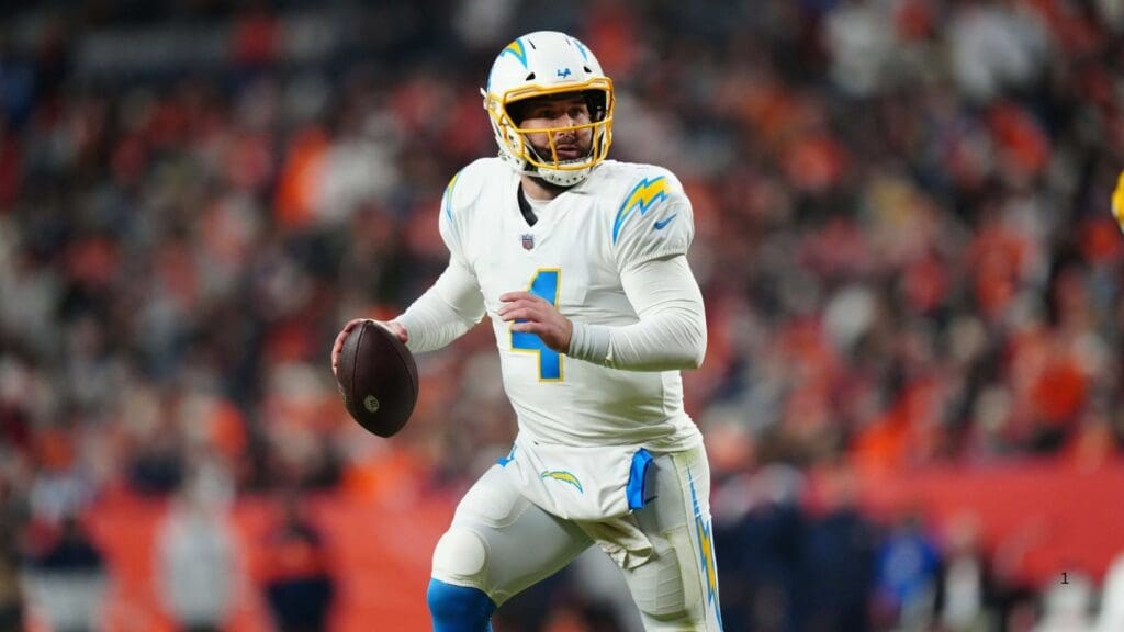 Jan 8, 2023; Denver, Colorado, USA; Los Angeles Chargers quarterback Chase Daniel (4) scrambles in the fourth quarter against the Denver Broncos at Empower Field at Mile High.