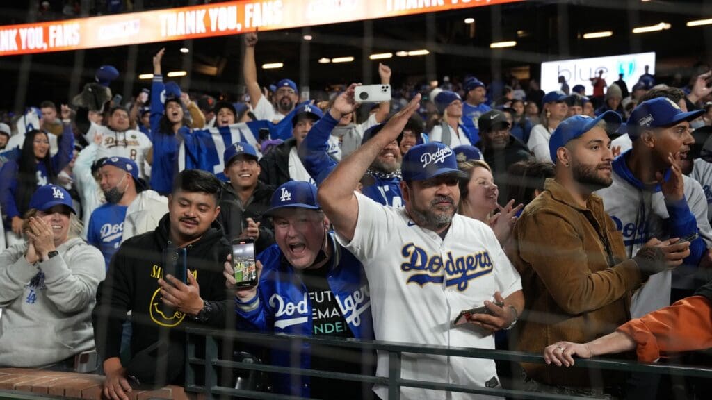 Oct 14, 2021; San Francisco, California, USA; Los Angeles Dodgers fans celebrate after a victory over the San Francisco Giants in game five of the 2021 NLDS at Oracle Park.